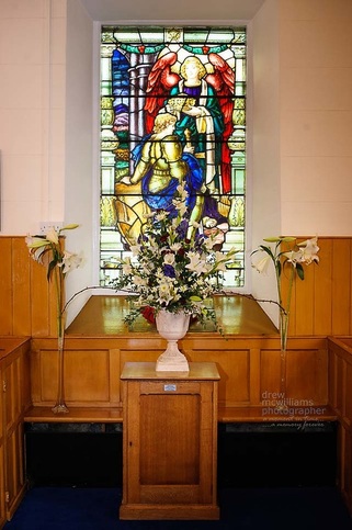 Stained glass window decorated for Harvest Service
